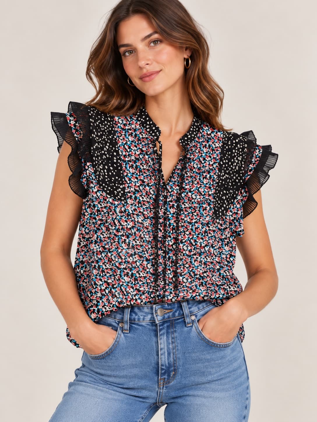 Black floral sleeveless top with pleated ruffles — sister jane